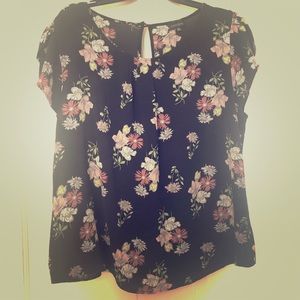 Black blouse with flowers.